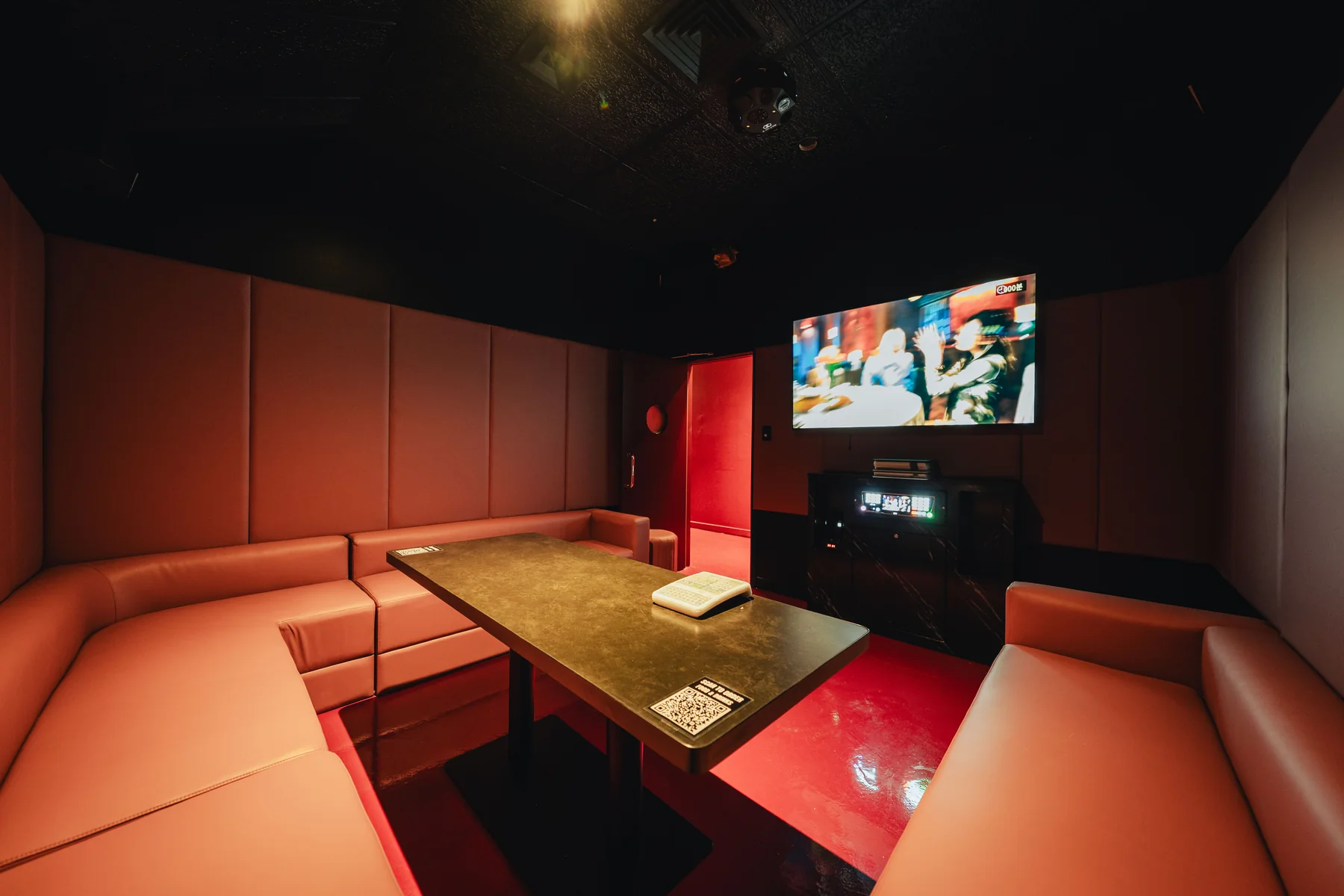 Bibi karaoke room with wraparound seating and song screen