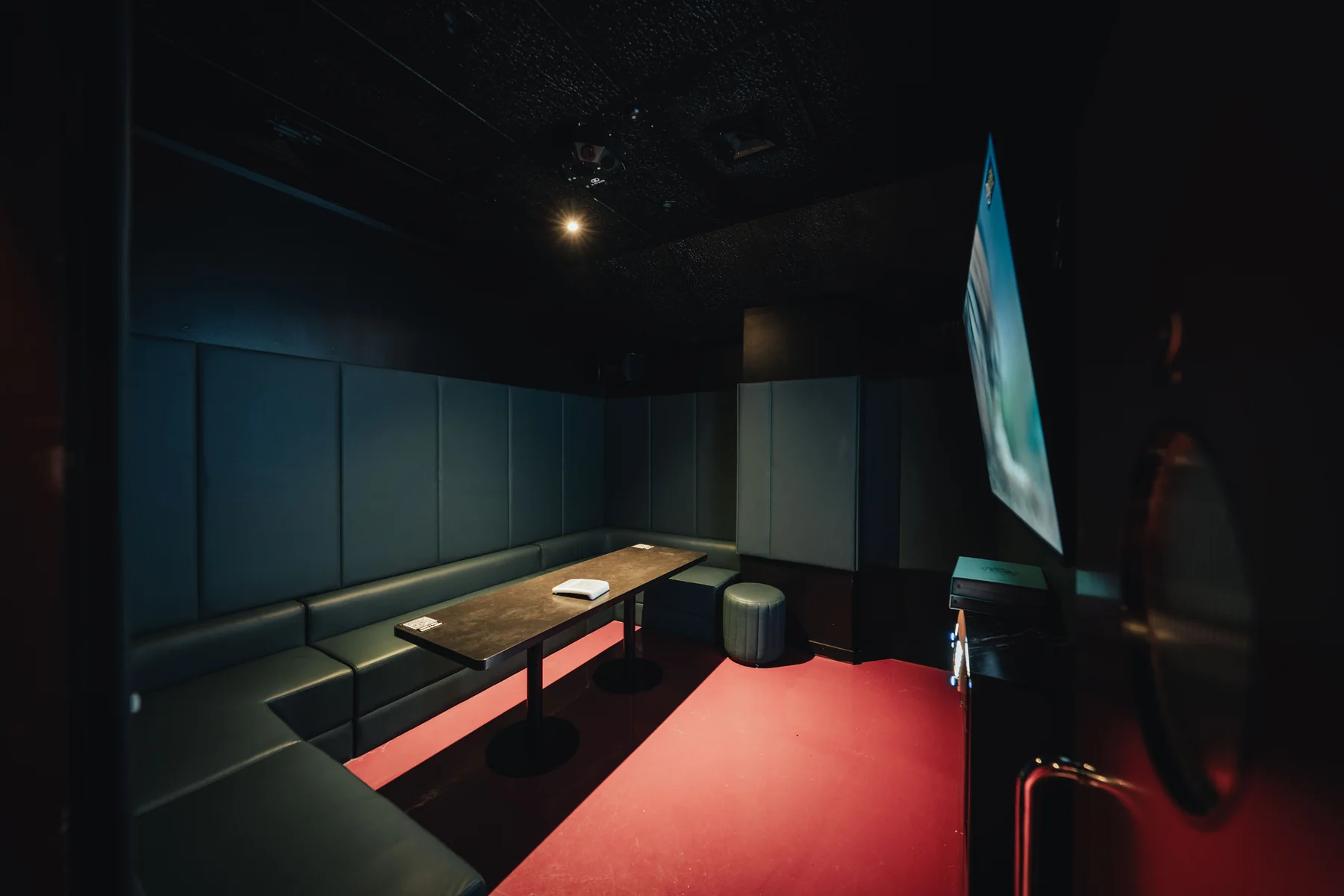 Intimate Bibi karaoke room with dark seating